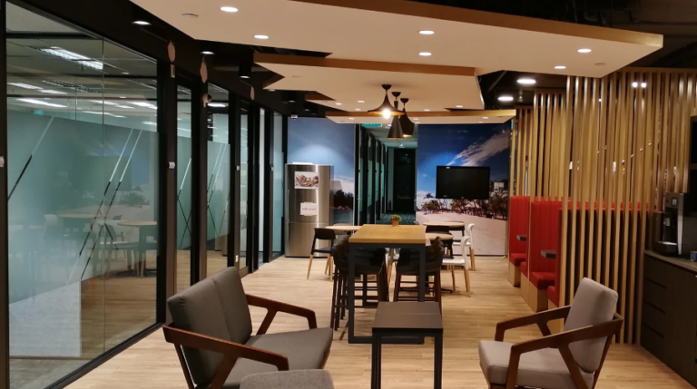 Modern coworking space with sleek design and meeting area.
